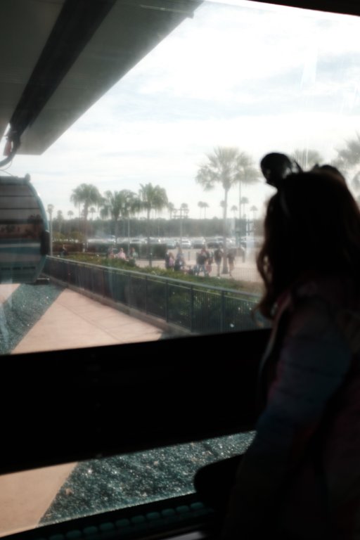 Girl riding skyrail looking out the window